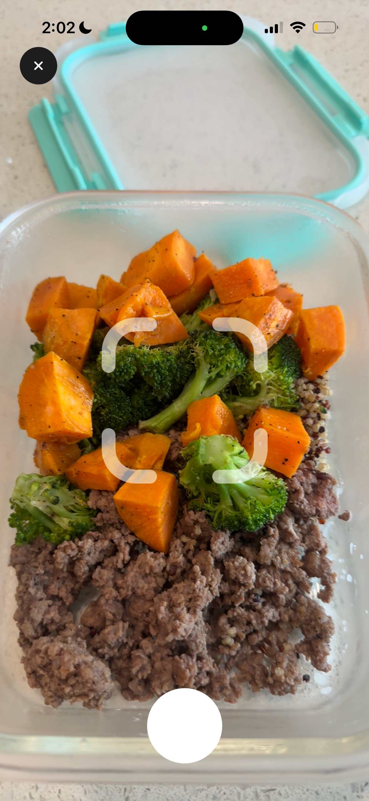 Cal360 scanner capturing a meal prep container with beef, sweet potatoes, and broccoli